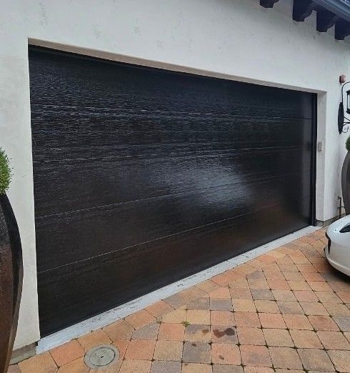 16x8 Flush Black Insulated Steelback Sectional Garage Door,$4500