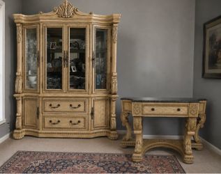 Beautiful, ornate 2-piece furniture set featuring a large glass-door china cabinet/hutch and matching console table.