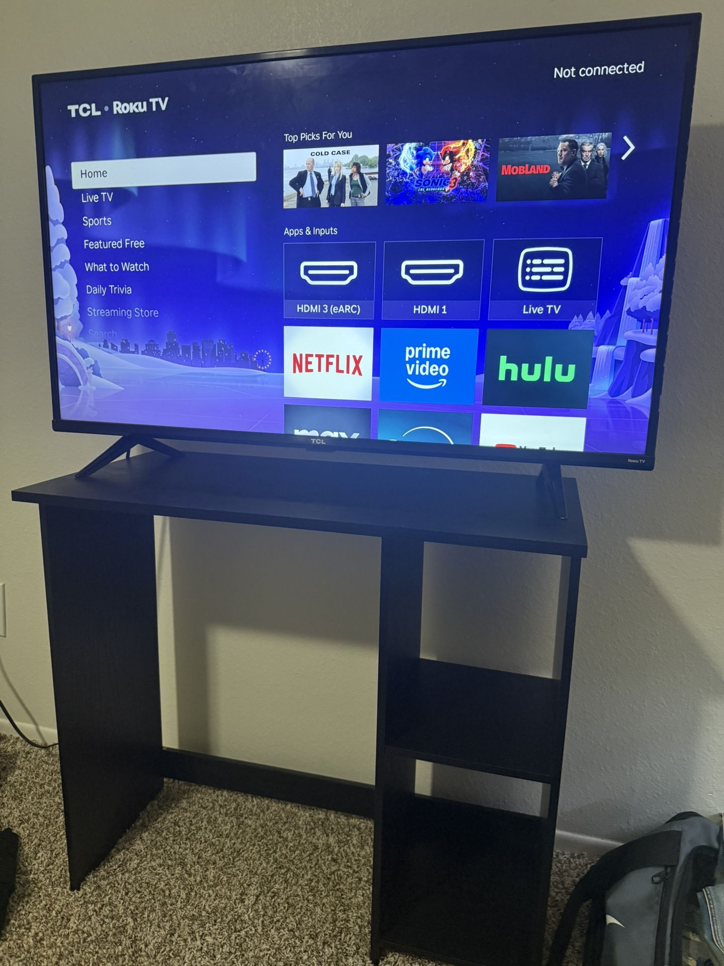 TCL Roku Tv and Shelf