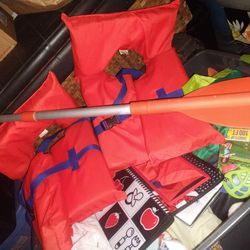 2 Life Jackets And An Adjustable Paddle