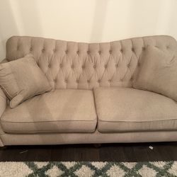 Couch, chair, and ottoman