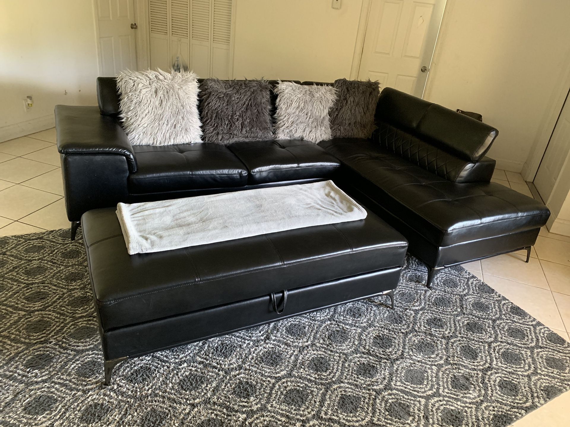 Black Sectional with storage ottoman