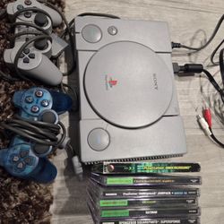 Playstation With Games And Controllers