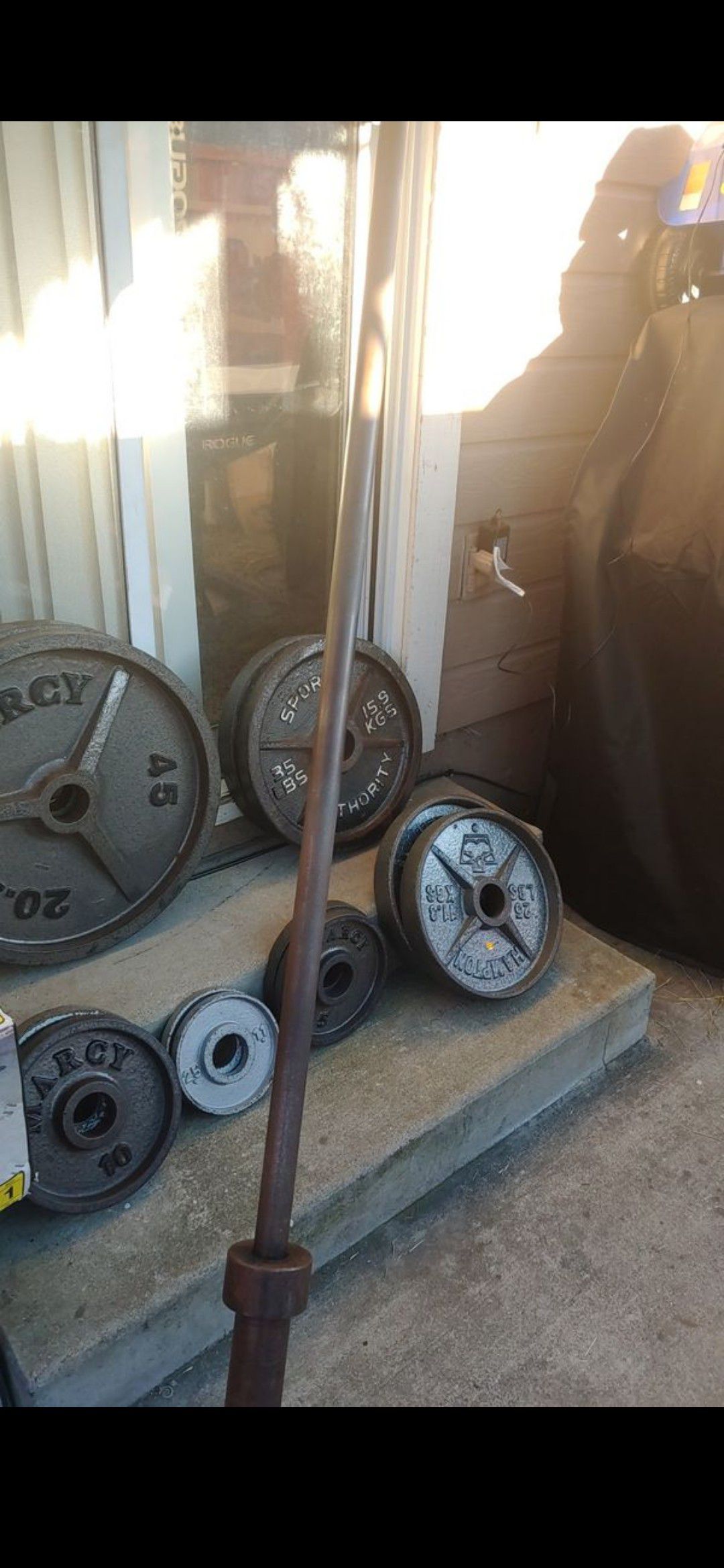 Olympic weight set with bar. 305 w 45lb bar. 350lb total.