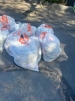 10 garbage bags full of clothes for personal use or resale