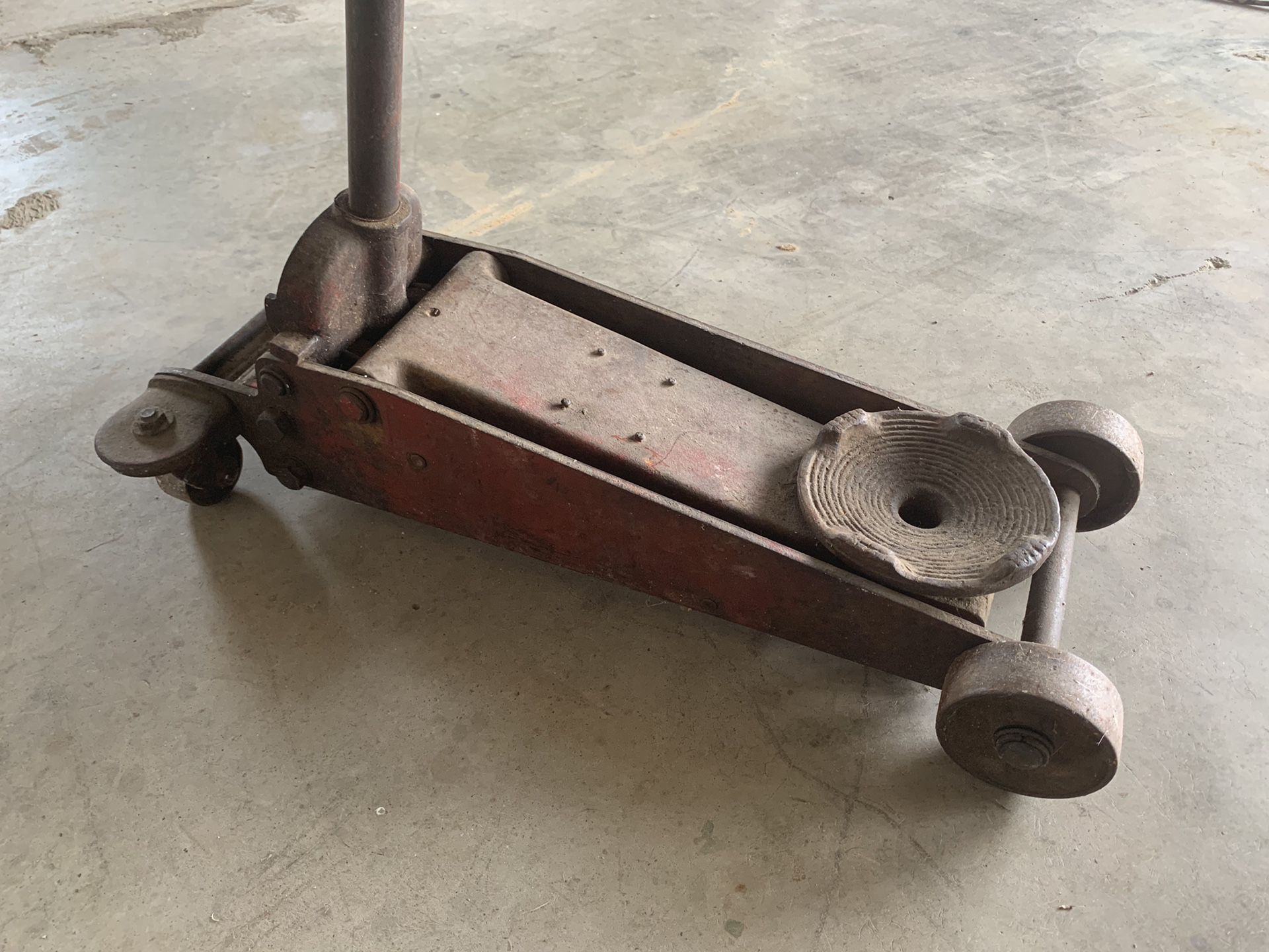 Old floor jack. All steel and super heavy. Is slowly releasing so will need repaired
