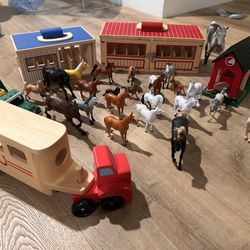 wooden horse farm / stable playset with multiple horses, trailers, barns, fences, and vehicles