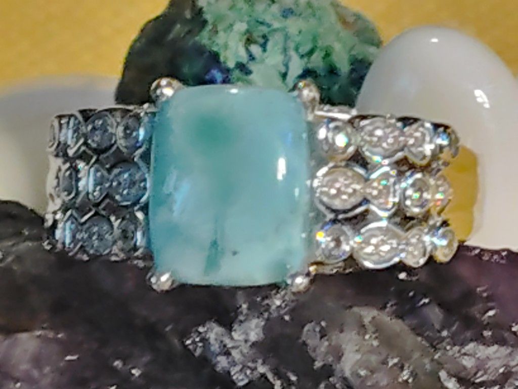 WHAT A NATURAL BEAUTY LARIMAR, THE SIMPLICITY OF ZIRCON, ENCIRCLED AS THIS IS. ON THE SHOULDERS. 100% - 925 SILVER. SIZE 7