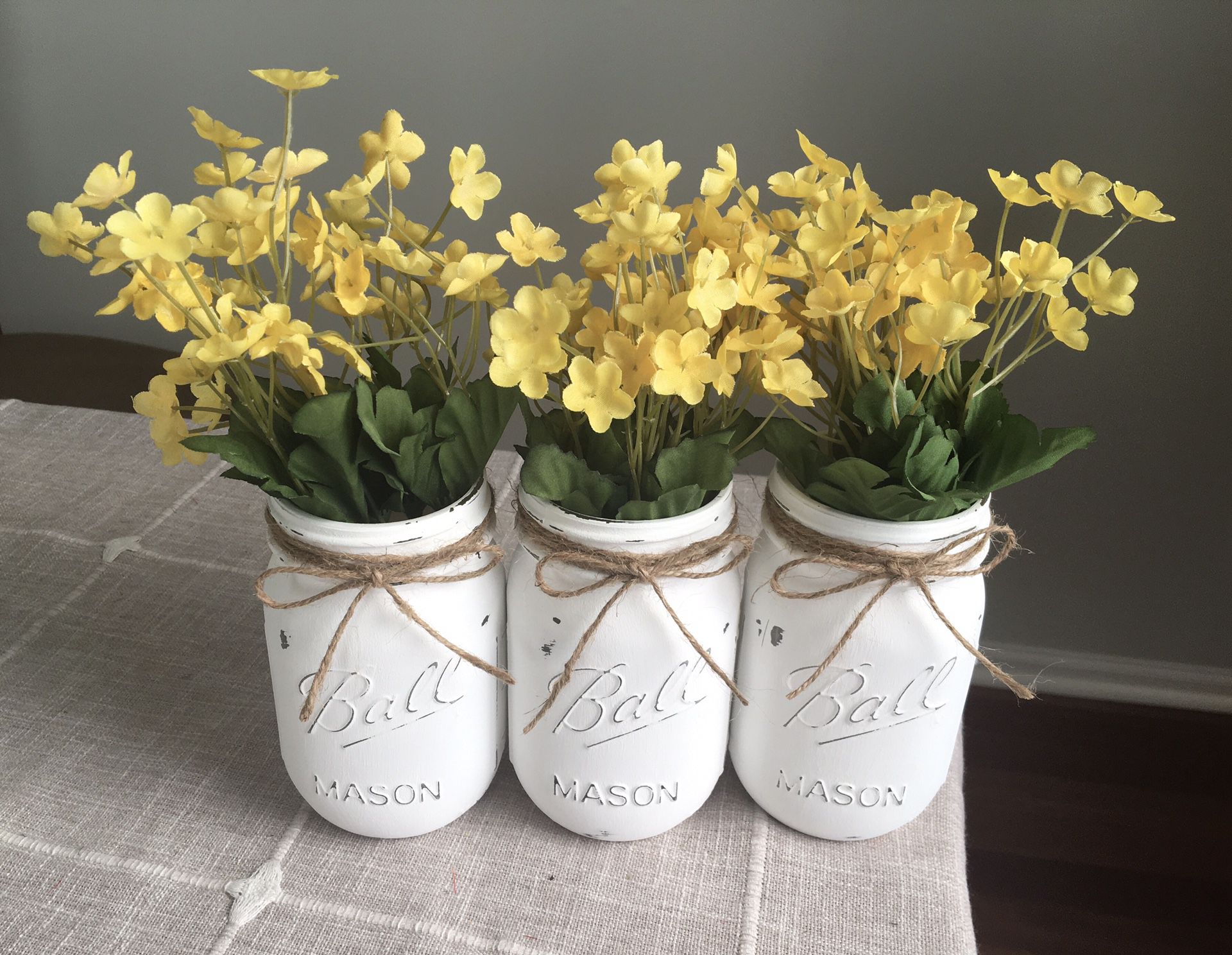 Distressed mason jar vases with flowers included!! Jar/flower choices shown in photos $16 for 3