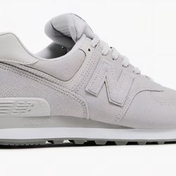 New Balance woman's 574 pink reptile snakeskin , size 7