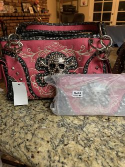 Pink skull concealed carry purse
