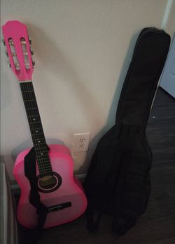 Pink guitar with case