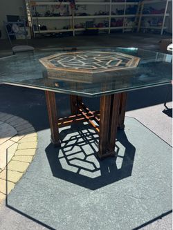 Glass top wood carved base octagon table