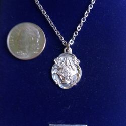Sterling Silver Virgin San Juan Medal sold on an 18-in Stainless Steel Chain. Religious jewelry.