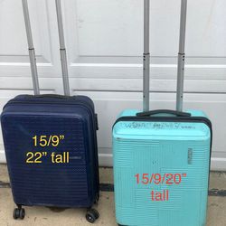 two American tourister carry on spinner suitcases.
