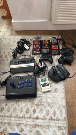 Saga games lot Nintendo , Atari , Xbox controllers, charger