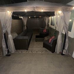 Backyard Brown Gazebo Setup With Fan Lights Hammock Mist System And Firepit