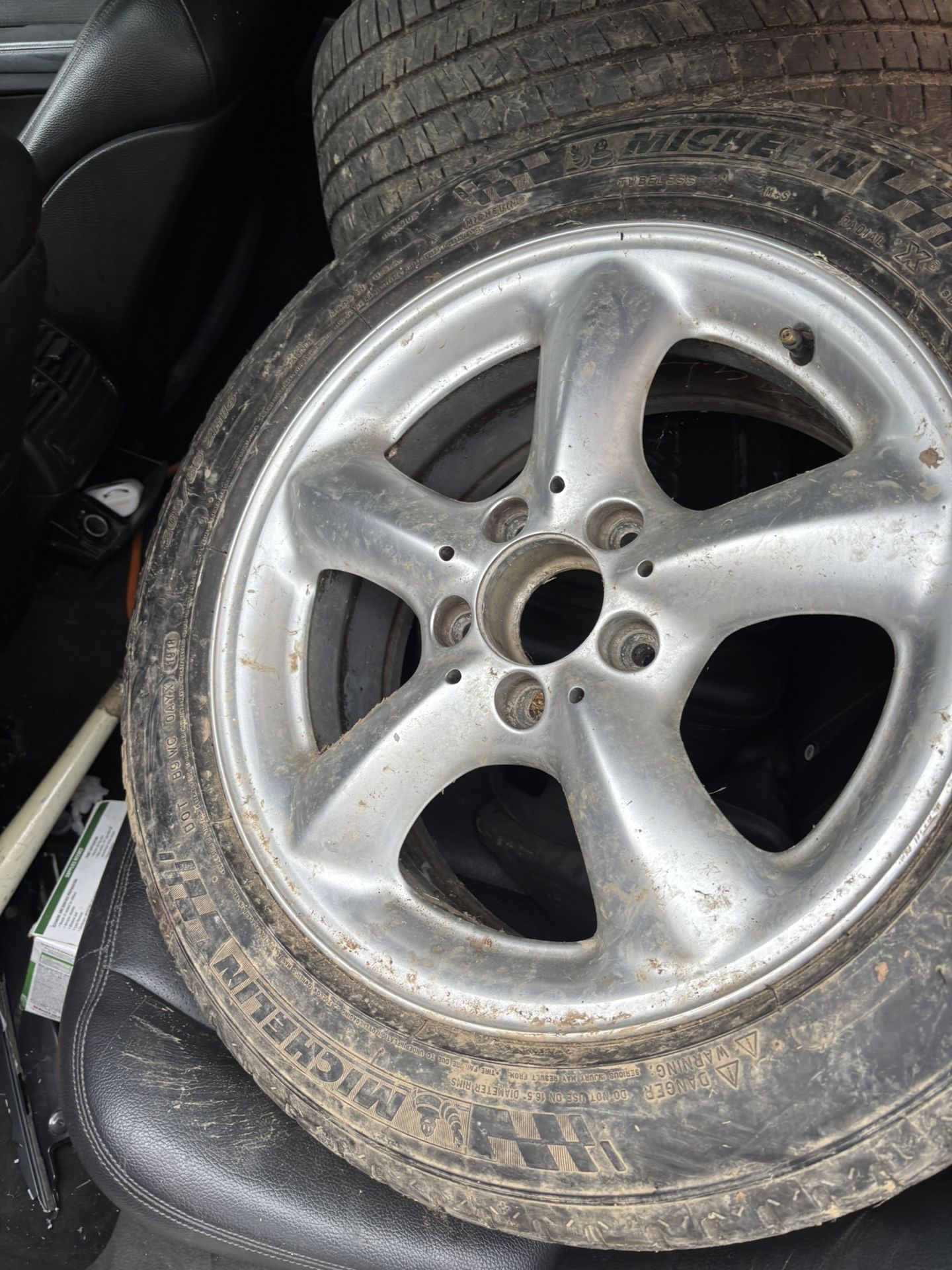 205R 16 in the front and 225R 16 in the back all four rims and tires