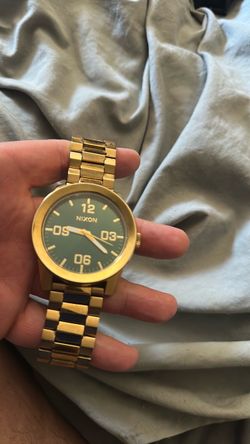 Green faced Nixon watch