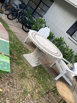 Two piece concrete mosaic table.