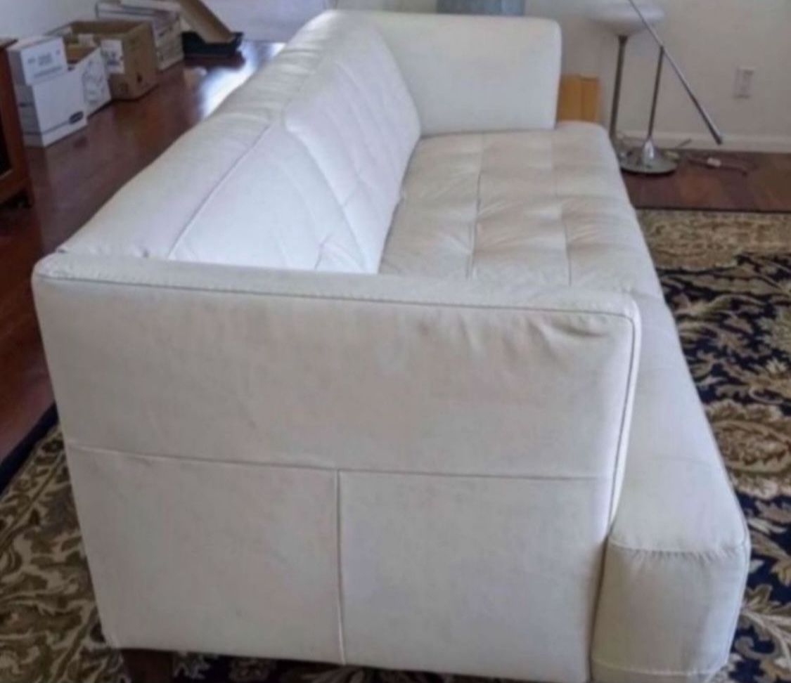 Modern cream color Leather Sofa 6 ft 9 in long In Great Condition Must Sell Soon it’s been in my storage for 2 years can deliver