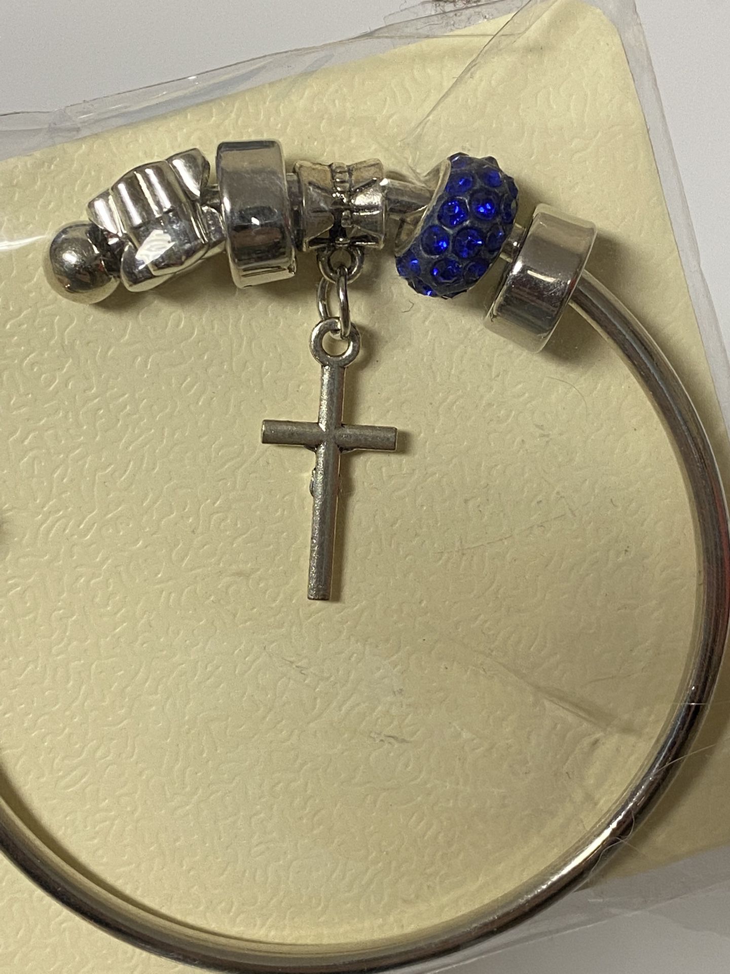 D’Bello Silver Tone Open Bangle Bracelet with Cross Charm and Silver and Blue Sparkle Beads NEW 