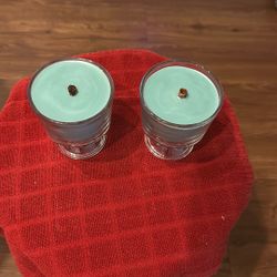 2 Woodwick Candles With An Aqua Wax And An April Fresh Fragrance