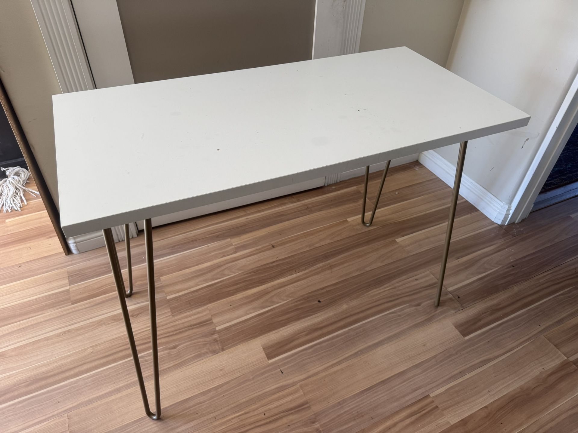 White Modern Table with Gold Hairpin Legs