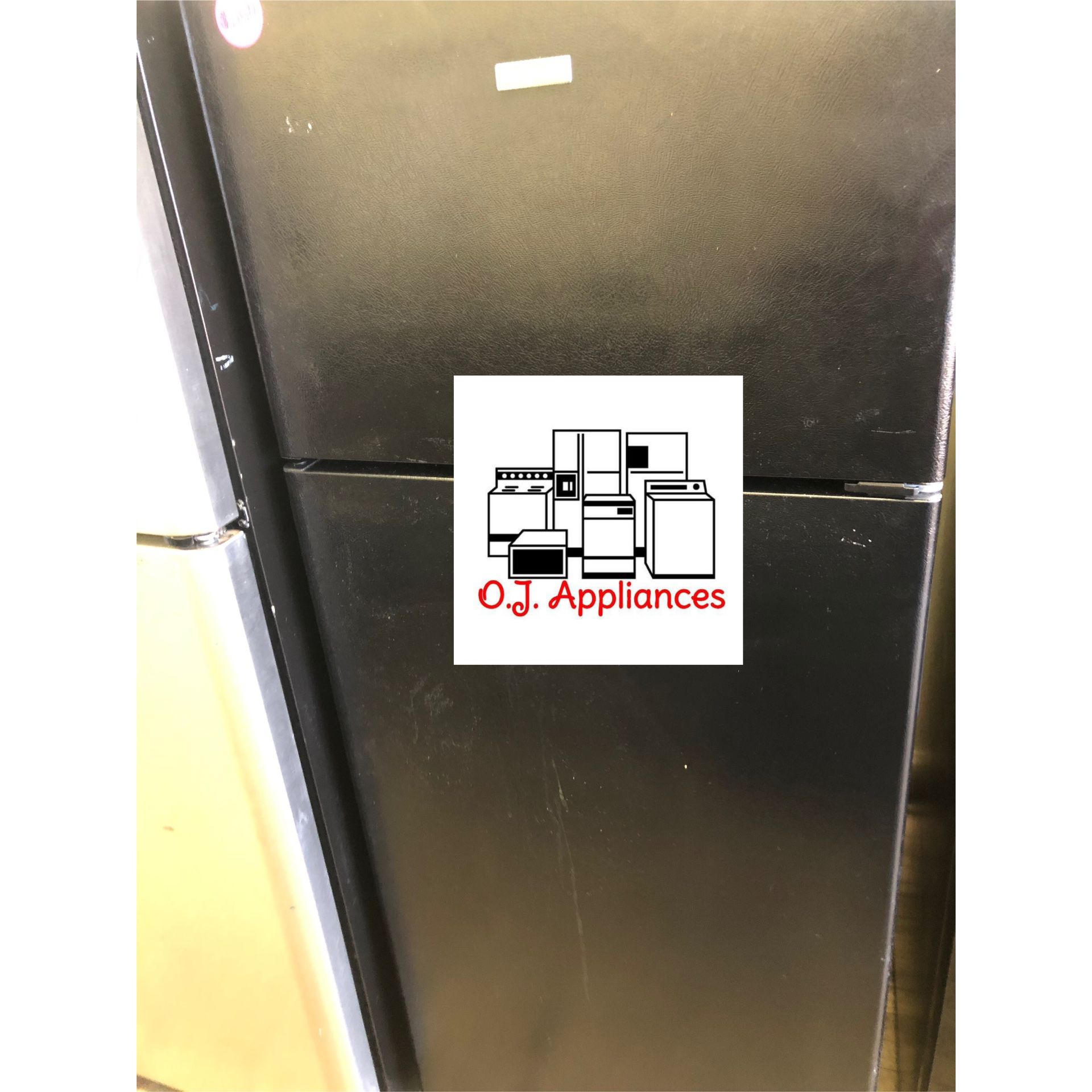 Black hot point top mount refrigerator
