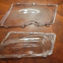 Two Driver side Headlight Lenses New