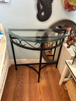 Black metal glass top half moon table