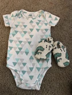 Onesie and moccs both fit like 3-6m