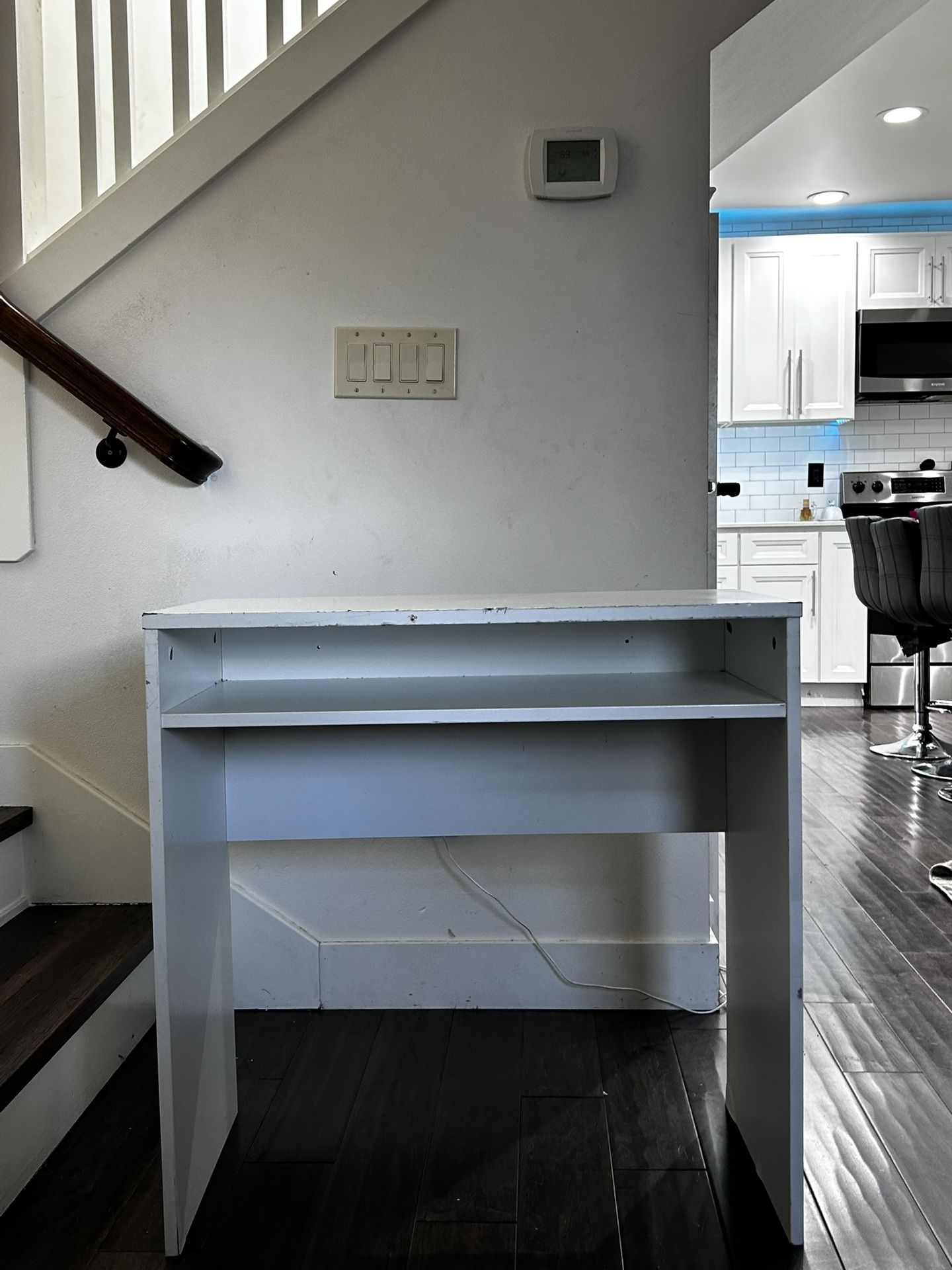 White wooden desk and chair