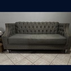 Large gray modern sofa armchair for home.