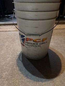 Bucket with fast pitch soft balls