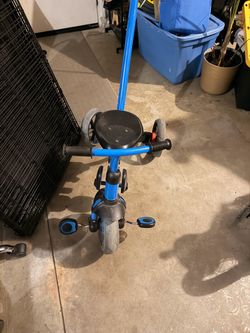 Kids tricycle with push handle