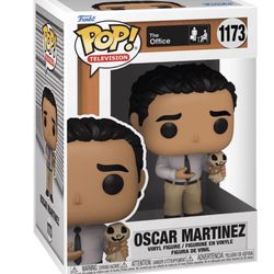 Oscar Martinez with Michael’s goodbye gift Funko Pop