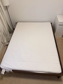 Bed frame with a topper
