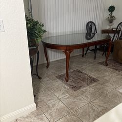 Wooden Table with glass cover and 6 chairs