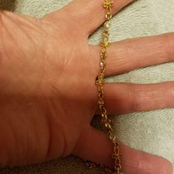 Bracket from Avon 
Pretty Gold plated bracelet with a cross's and cubic Zirconia diamonds.

Please go to my page and see other items that I have liste