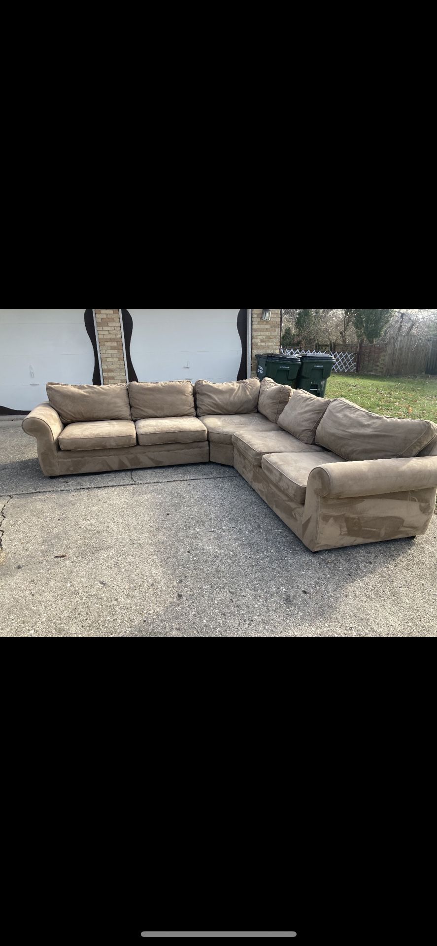 Brown 3 piece wedge sectional by Pottery Barn.