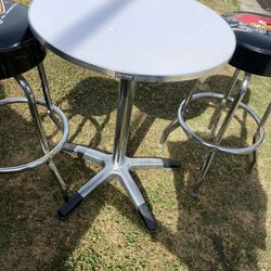 2 Barstools And Table