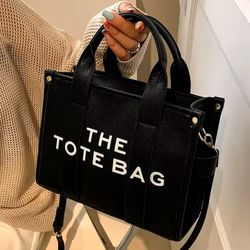 Marc Jacob’s The Tote Bag In Black 