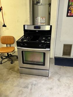 Gas stove 4 burnes stainless steel everything works we deliver