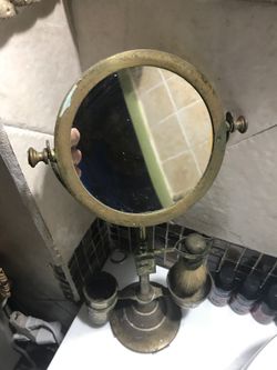 Antique shaving mirror and brush.
