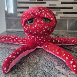Red octopus stuffed animal with sequins