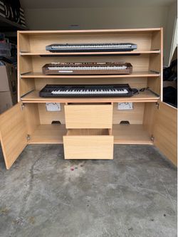 Grand Keyboard Storage Cabinet by AZ Studio.