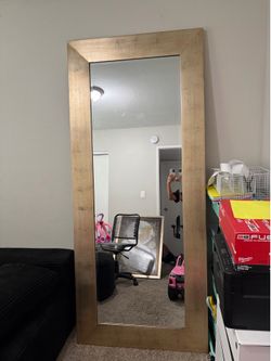 Oversized gold mirror