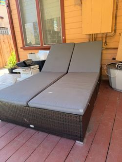 Patio daybed with cushions and side trays