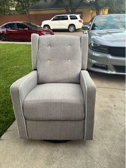 Grey swivel rocking chair (Delivery Available)